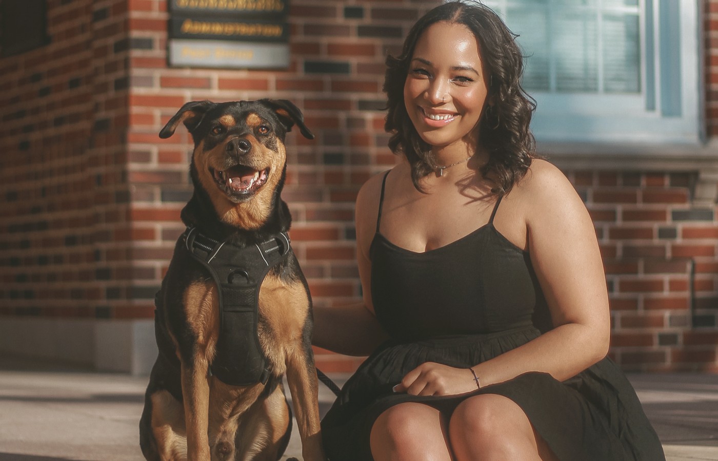 Team member with clinic dog outdoors